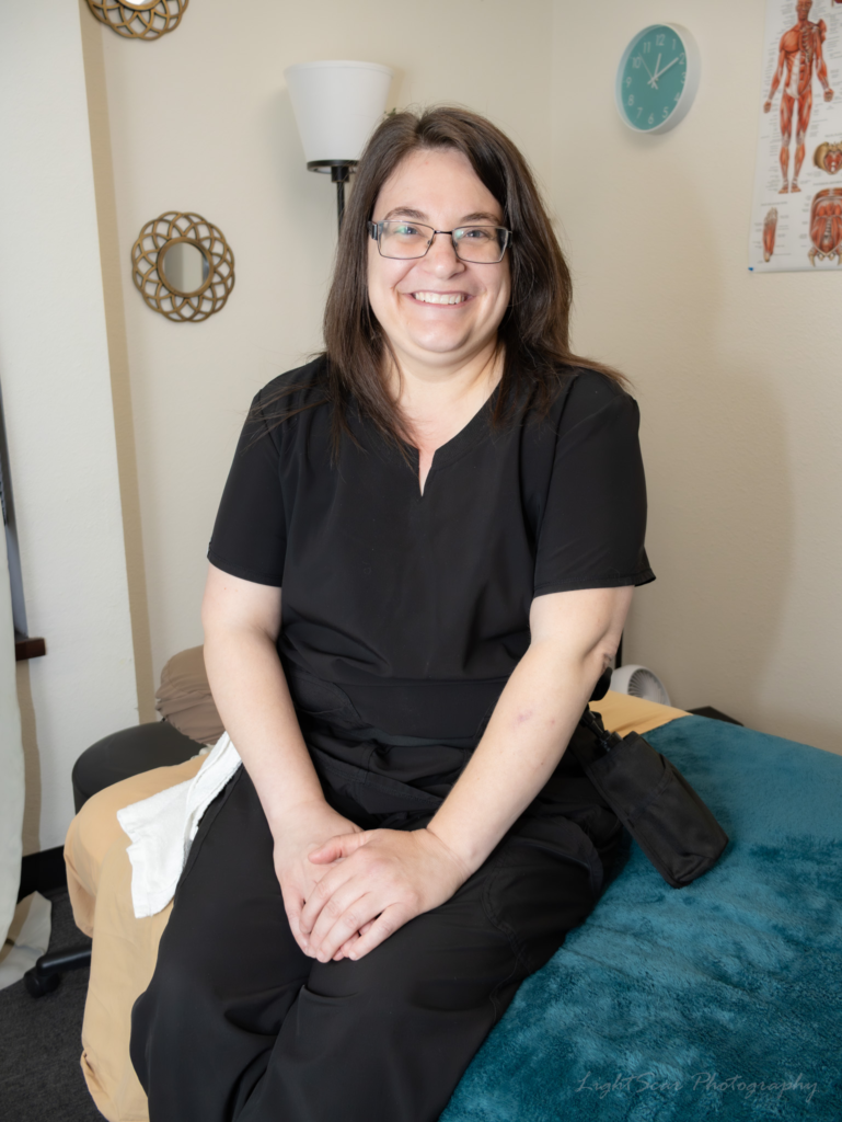 Michelle L., massage therapist in Aurora CO, providing restorative massage therapy
